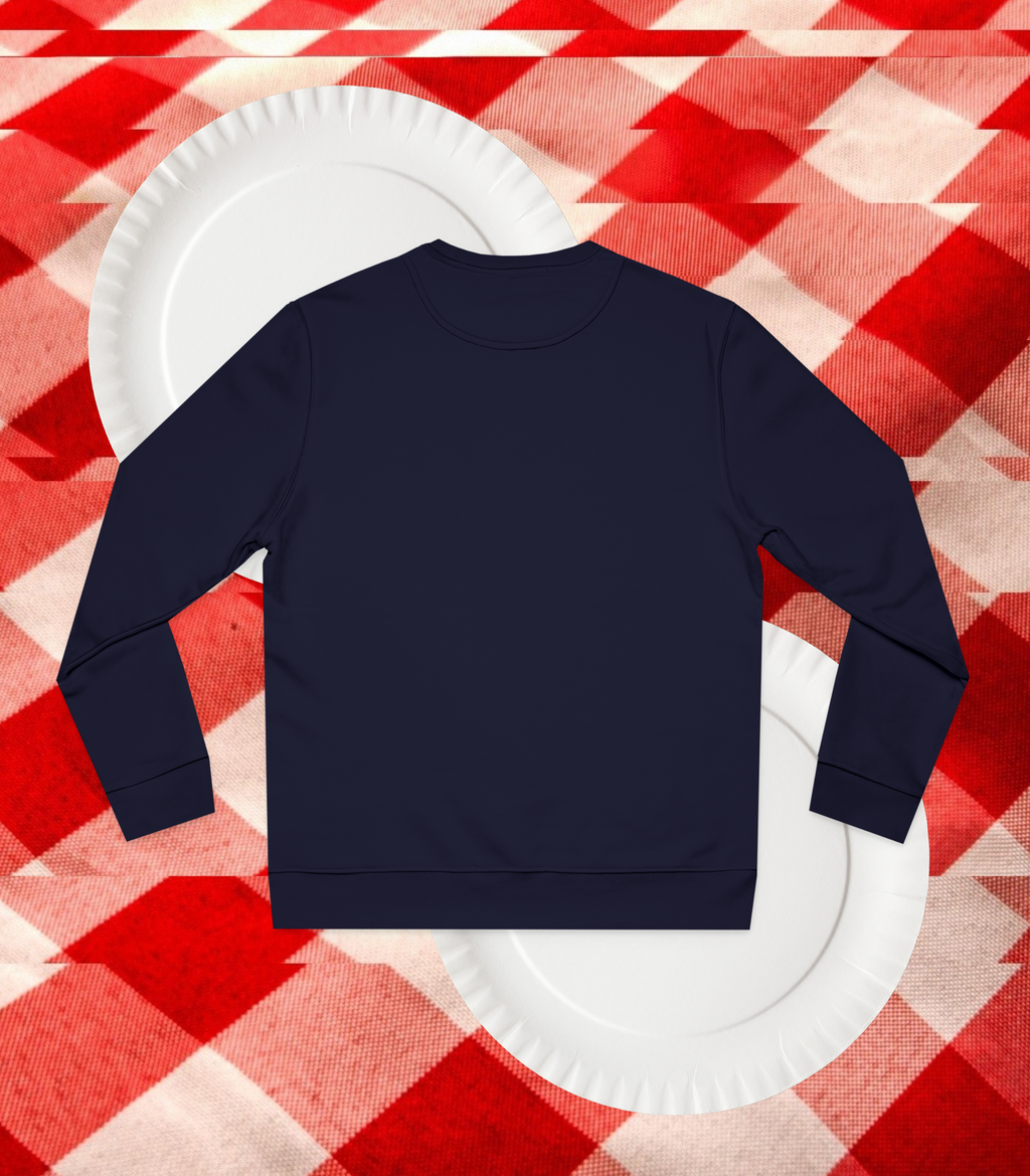 Back view of a French Navy sweatshirt on a white paper plate against a red and beige checkered background